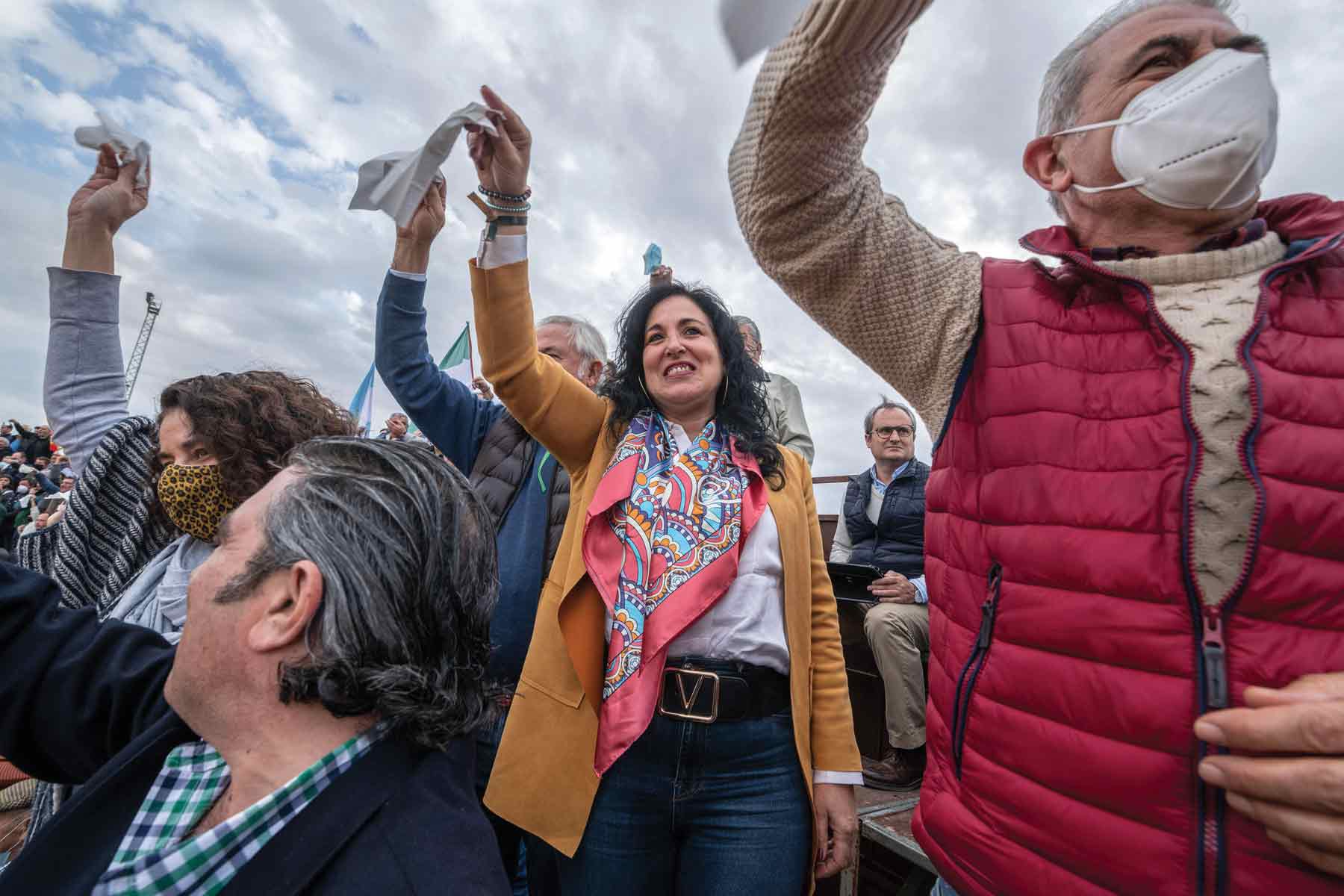 Spectators wave white handkerchiefs to celebrate the death of a bull in Sanlucar la Mayor, Spain