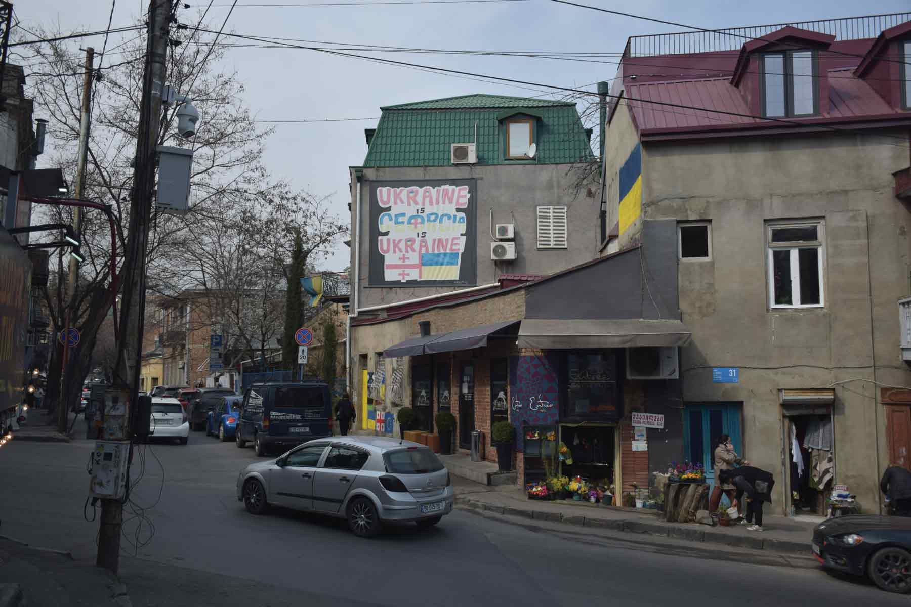 Slogans in support  of Ukraine are  visible across Tbilisi  but the Georgian  government has  yet to implement  any sanctions  against Russia